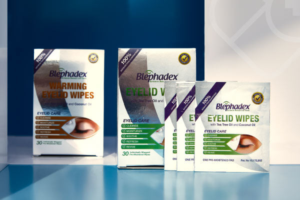 Four boxes of Blephadex eyelid wipes are displayed. The products include WARMING EYELID WIPES in red text and EYELID WIPES in green text. The boxes highlight features like cleansing, moisturizing, and soothing with tea tree oil and coconut oil.