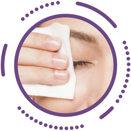 A person gently wipes their eye area with a facial cleansing pad. The image is framed by a purple circular border with dotted accents.