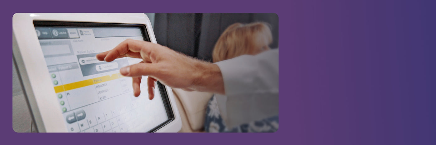 A person wearing a white coat is interacting with a touchscreen device displaying a menu. The background fades into a solid purple color.