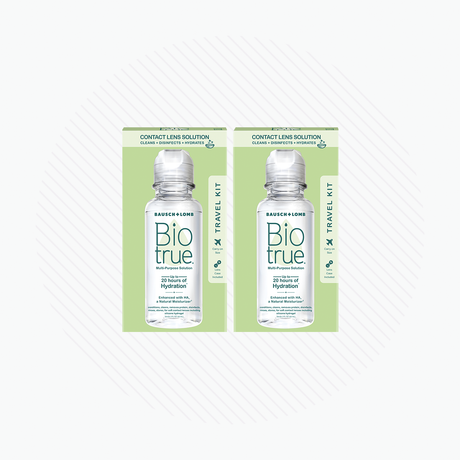 Two BioTrue Multipurpose Contact Lens Solution Travel Kits by Bausch + Lomb, each containing a 2 oz bottle, are set against a white background with subtle circular lines.