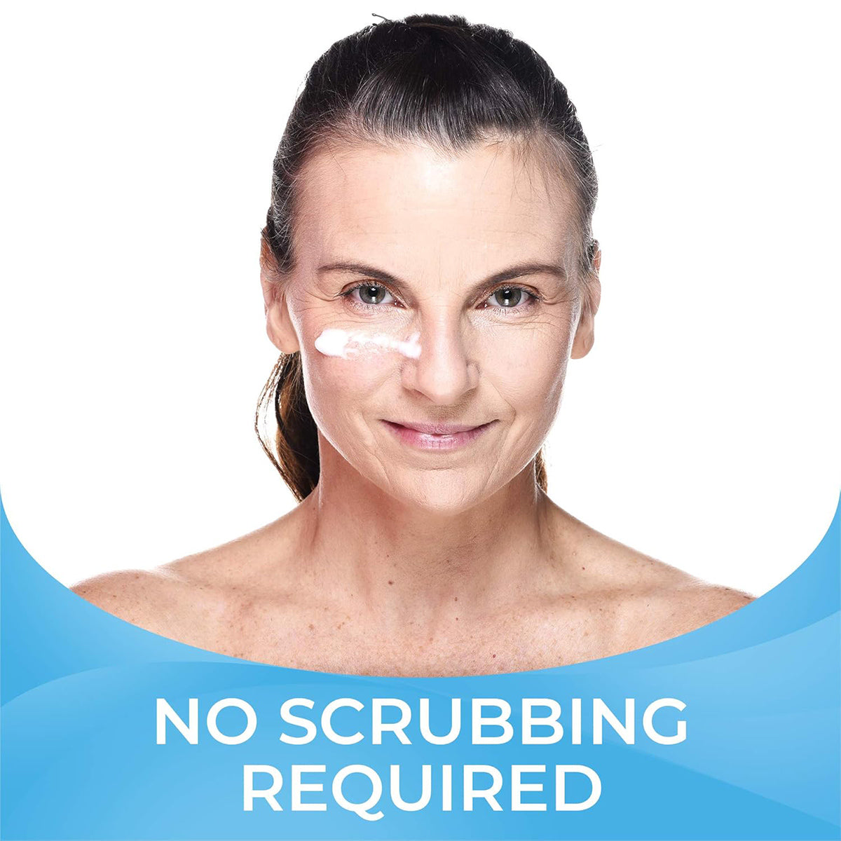 A woman with a gentle smile applies Cliradex Light Foam, an eyelash & eyelid cleanser with tea tree oil extract by PRN, to her cheek against a white background. Below, No Scrubbing Required is displayed in white on a blue curved banner.