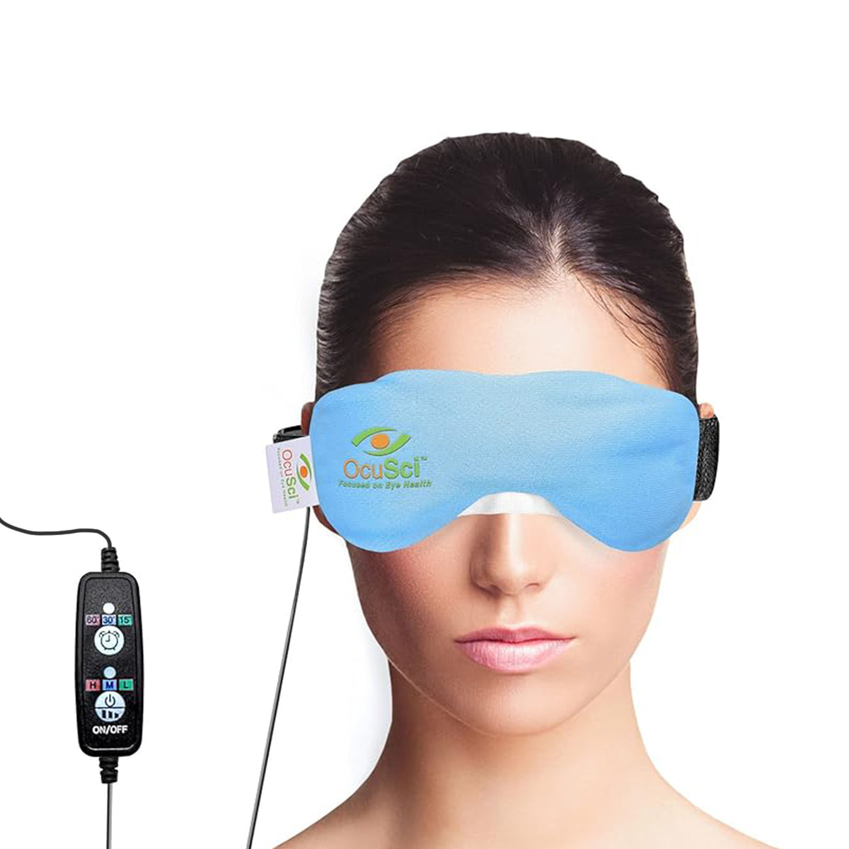 A woman, with her hair tied back, wears an OcuSci E-Compress USB Eye Heat Mask. This blue mask offers therapeutic heat for dry eyes with settings for 3 temperatures and a timer. A digital controller is attached for easy use of the innovative technology.