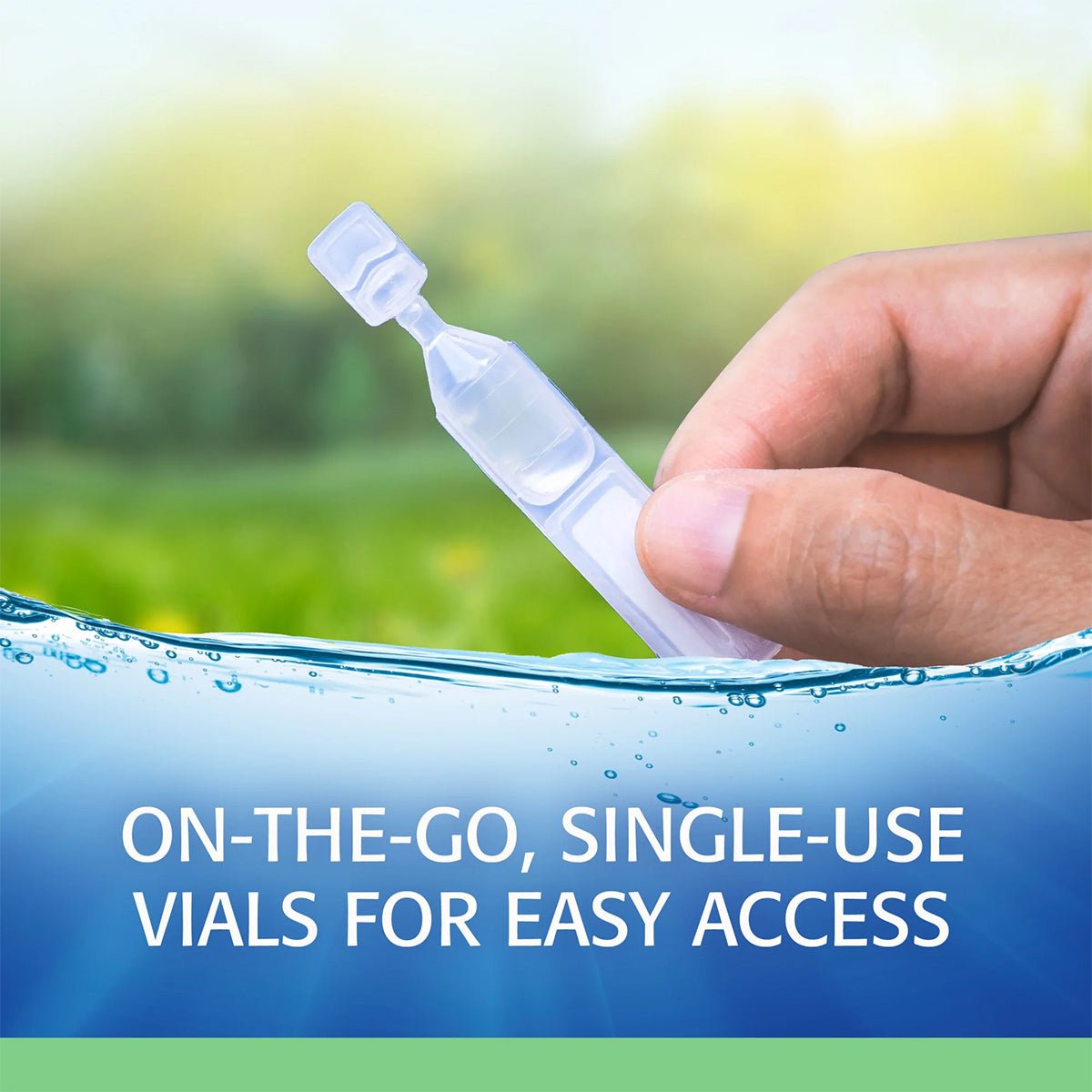 A hand holds a small vial of Refresh Plus Lubricant Preservative Free Eye Drops by Abbvie, set against a blurred green and sky background. Below, the text reads On-the-go, preservative-free vials for easy access, framed by a blue and green border.