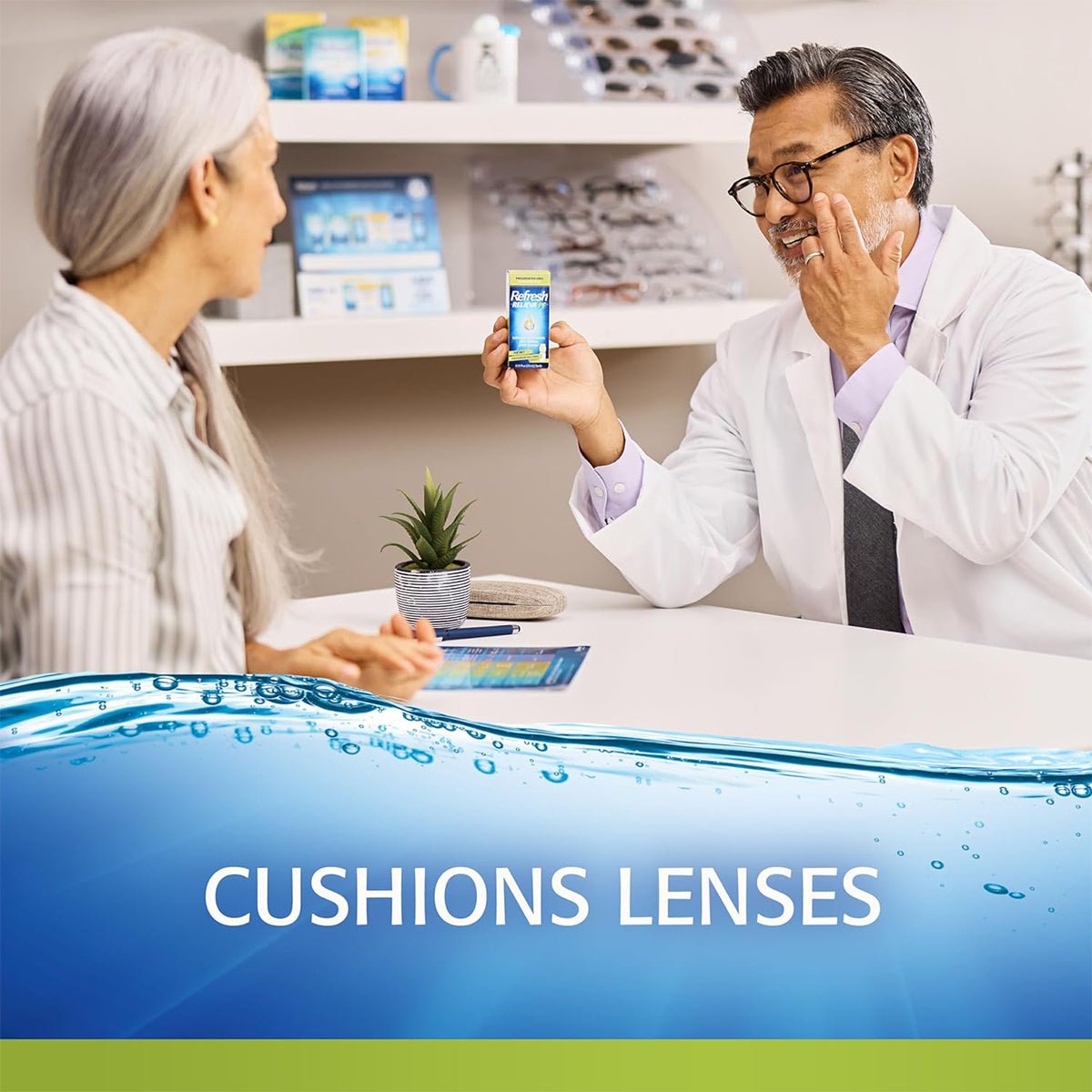 An optometrist in a white coat converses with a woman with long gray hair, showcasing Refresh Relieva for Contacts – Lubricant Eye Drops by Abbvie on a smartphone screen. They discuss hydration benefits for lens wearers, while CUSHIONS LENSES is highlighted by a calming water design.