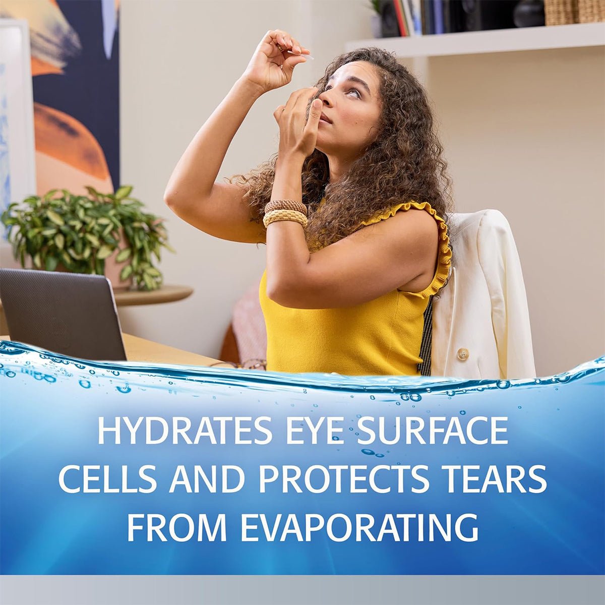 A woman with curly hair, wearing a yellow top, uses Abbvies Refresh Optive® Advanced Preservative-Free Eye Drops (30 single-use vials) at her desk with a laptop. The caption reads, Hydrates eye surface cells and offers triple-action relief to guard against tear evaporation.
