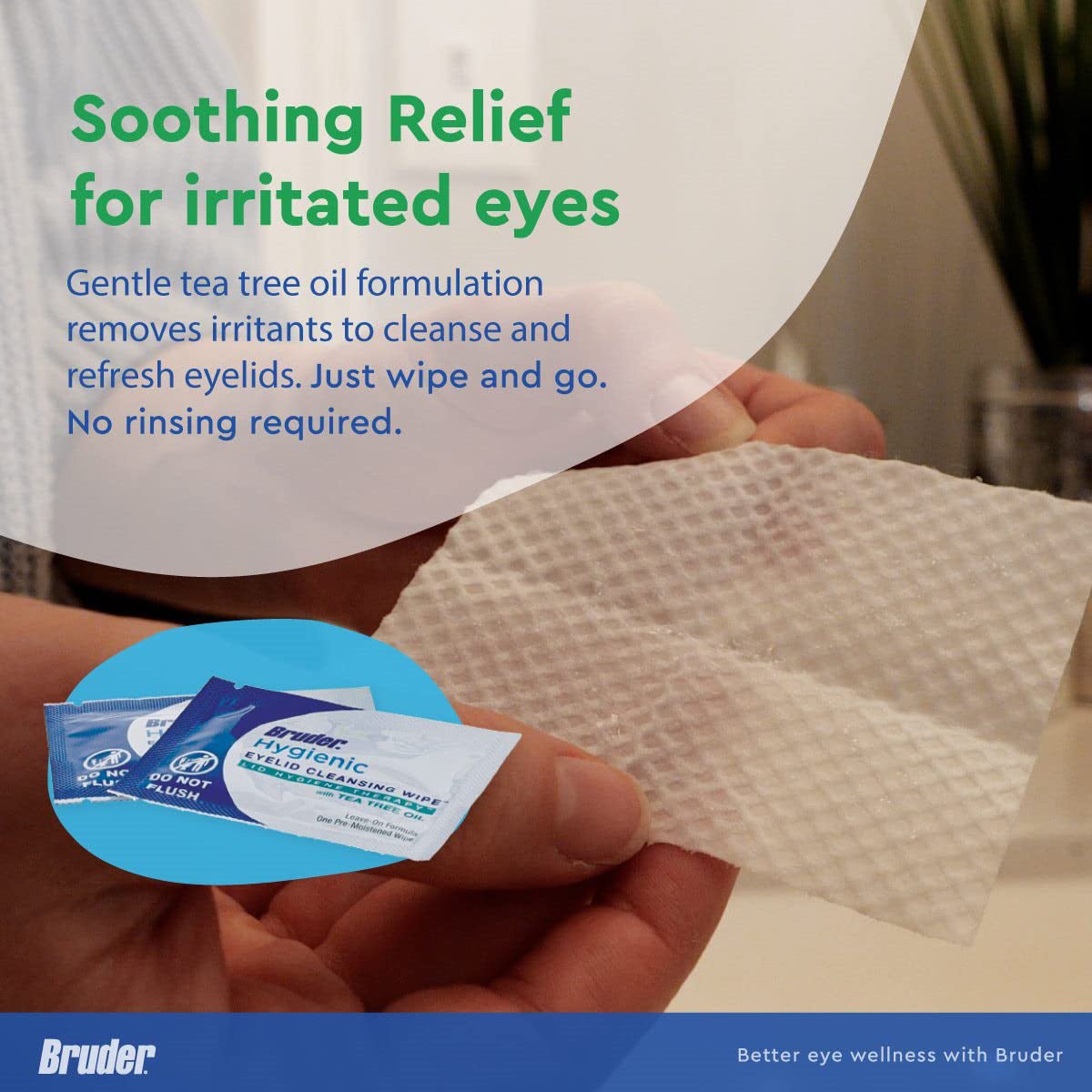 A person holds a Bruder Hygienic Eyelid Cleansing Wipe with Tea Tree Oil, providing soothing relief for ocular irritation. Two packets labeled Hygienic Eyelid Wipes are visible against a blurred background.