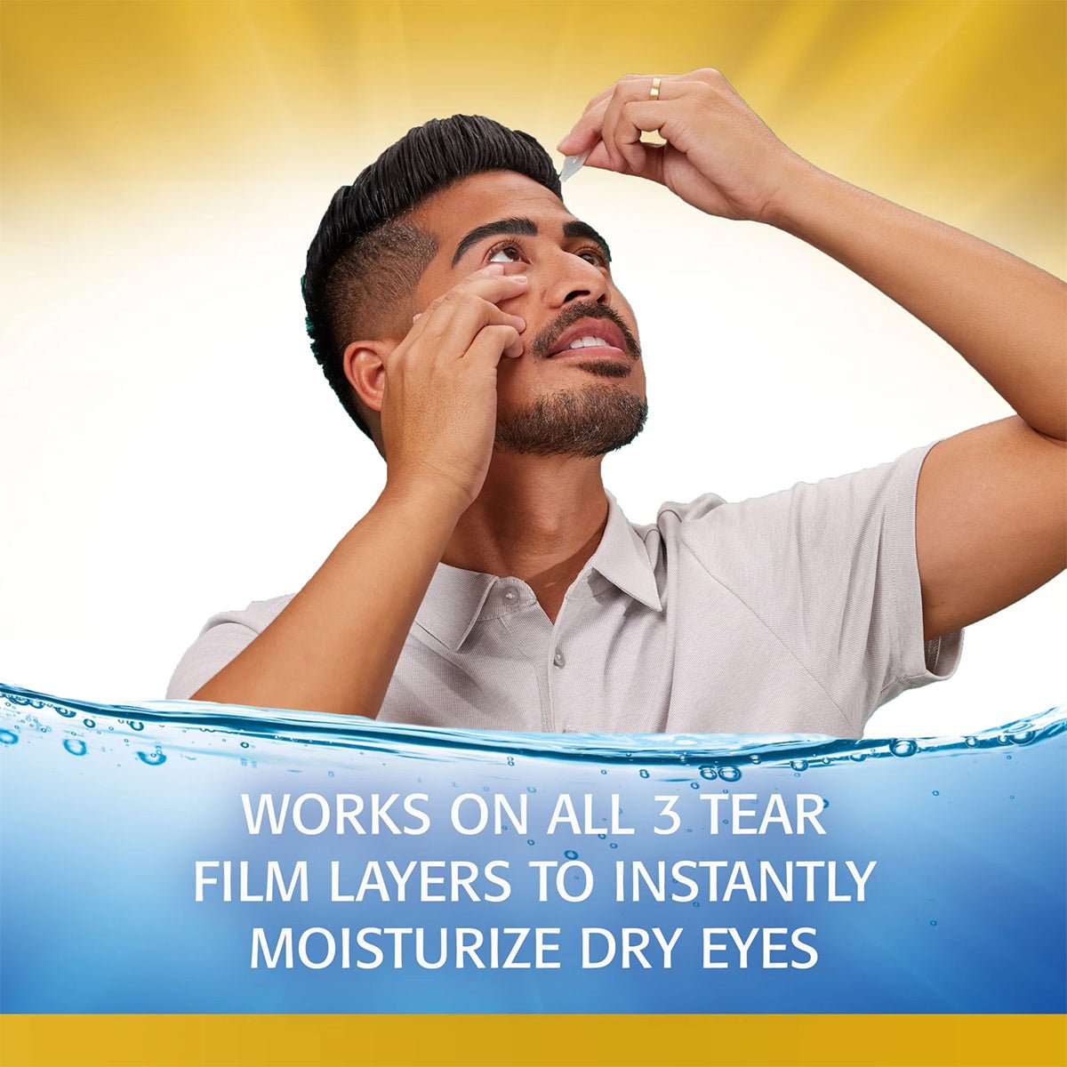 A man in a light gray shirt uses Abbvies Refresh Optive MEGA-3 Lubricant Eye Drops, gazing upwards against a bright yellow background. A blue wave graphic at the bottom reads: Works on all 3 tear film layers to instantly moisturize dry eyes.