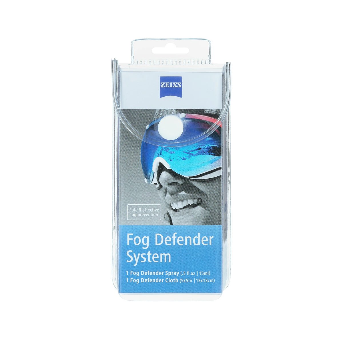 The ZEISS Fog Defender System features sleek blue-silver packaging with a smiling person in goggles, highlighting fog-free vision. Inside, the product includes the Zeiss Anti-Fog Spray for Glasses and one microfiber cloth for effective lens cleaning and fog prevention.