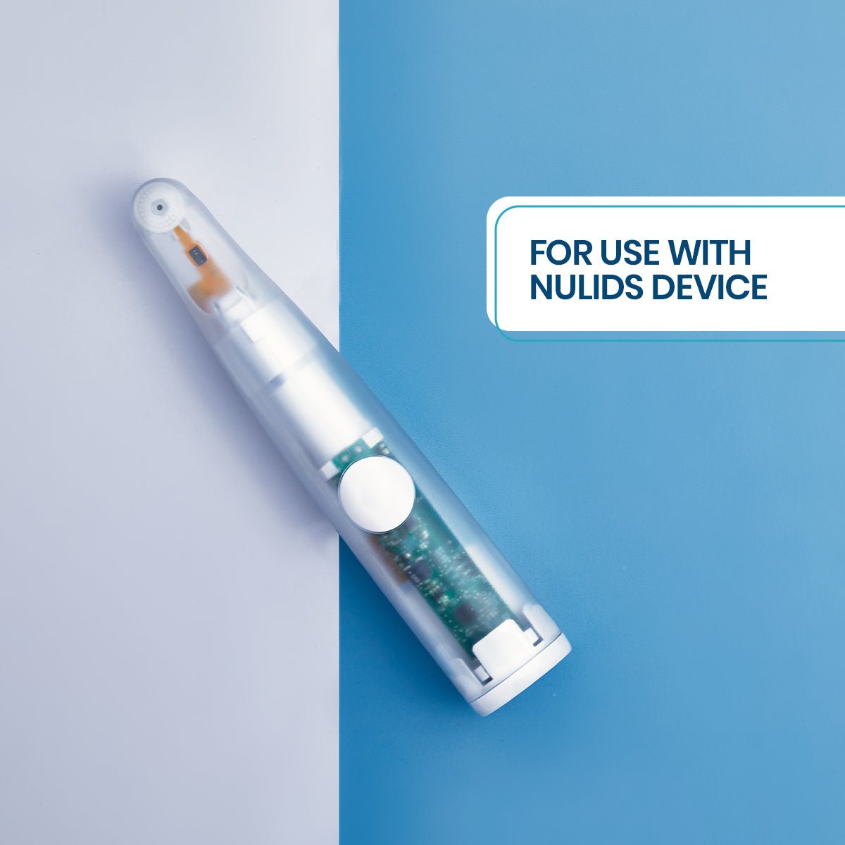 Close-up of a NuLids device, designed for dry eye relief, against a blue and white background with text overlay For use with NuLids Device. The white device has a rounded top and visible circuitry inside. Suitable for use with NuLids Replacement Tips by NuSight Medical.