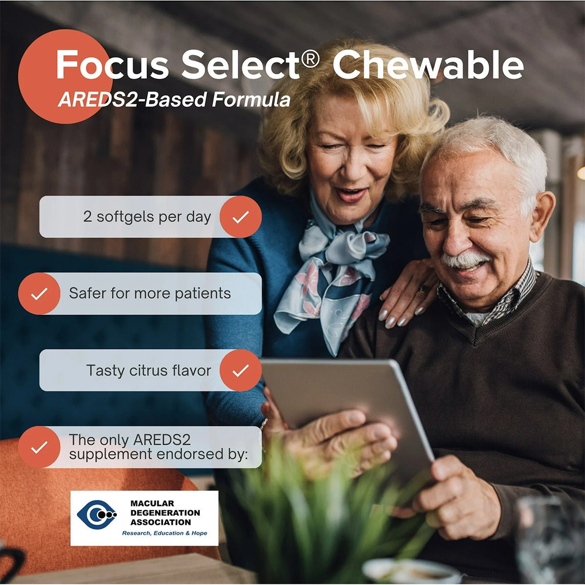 An elderly couple smiles at a tablet showcasing Focus Select Citrus Chewable AREDS2 Based Formula from Focus Vitamins, highlighting benefits like 2 softgels per day, a tasty citrus flavor, safer for more patients, and endorsed by the Macular Degeneration Association for macular health support.