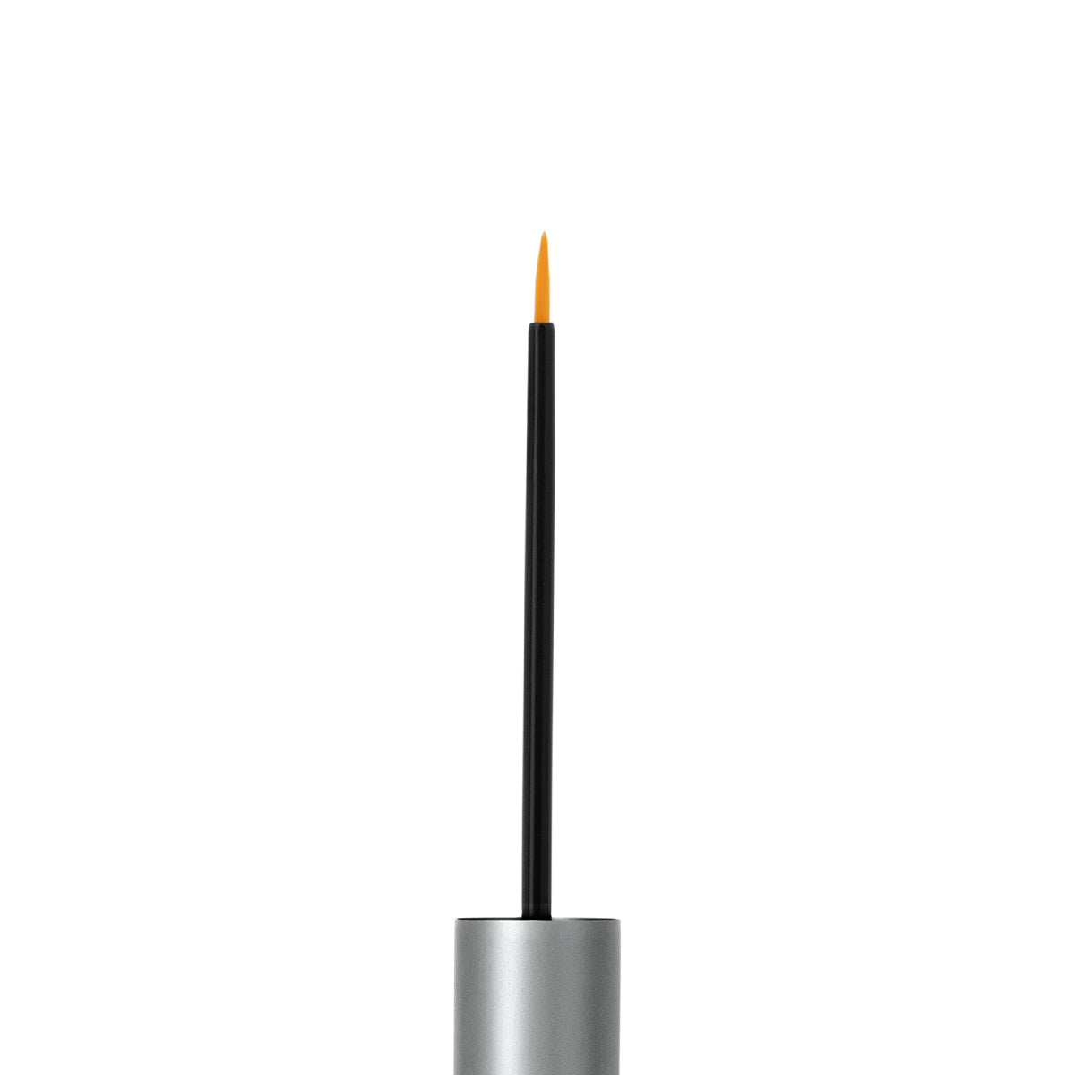 A close-up shows a thin black brush with an orange tip designed for applying RevitaLash Advanced PRO Eyelash Conditioner and Enhancing Serum. The brush, inserted in a silver handle, stands vertically against a white background to deliver its lash-enhancing formula.