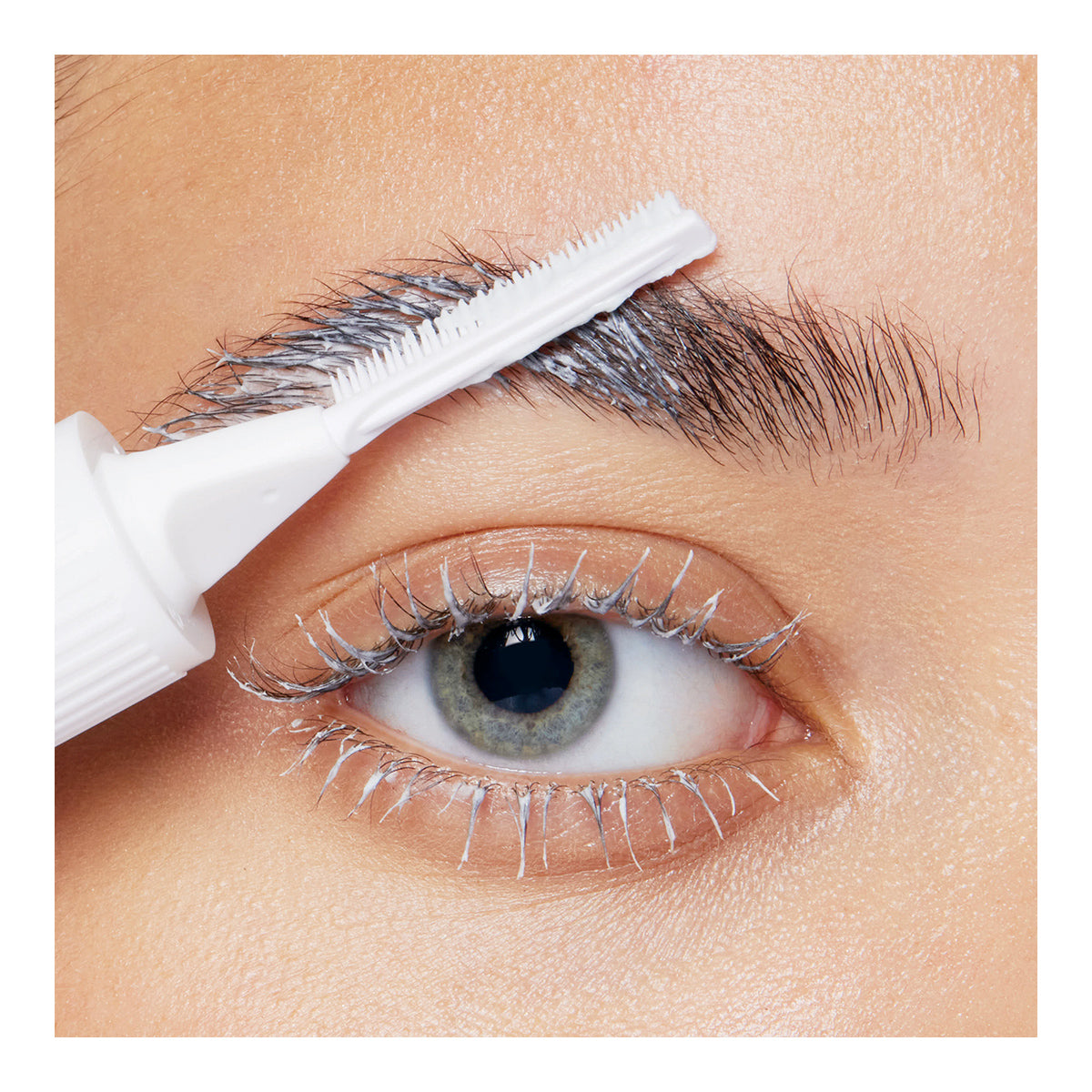 A close-up shows RevitaLash Lash and Brow Masque gently applied to eyelashes, enhancing them subtly. A white brush tool shapes and defines the eyebrow, resembling a professional brow treatment.