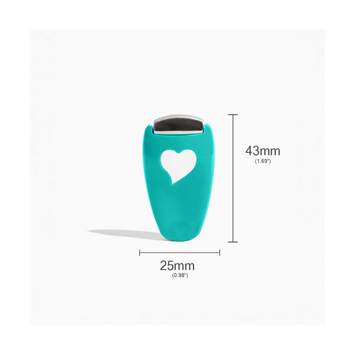 The We Love Eyes - Focused Eye Roll features a teal heart shape with a gray top and stainless steel finish. At 25mm wide and 43mm tall, it efficiently enhances eye cream absorption, tones, depuffs, and relaxes tired eyes against a white background.