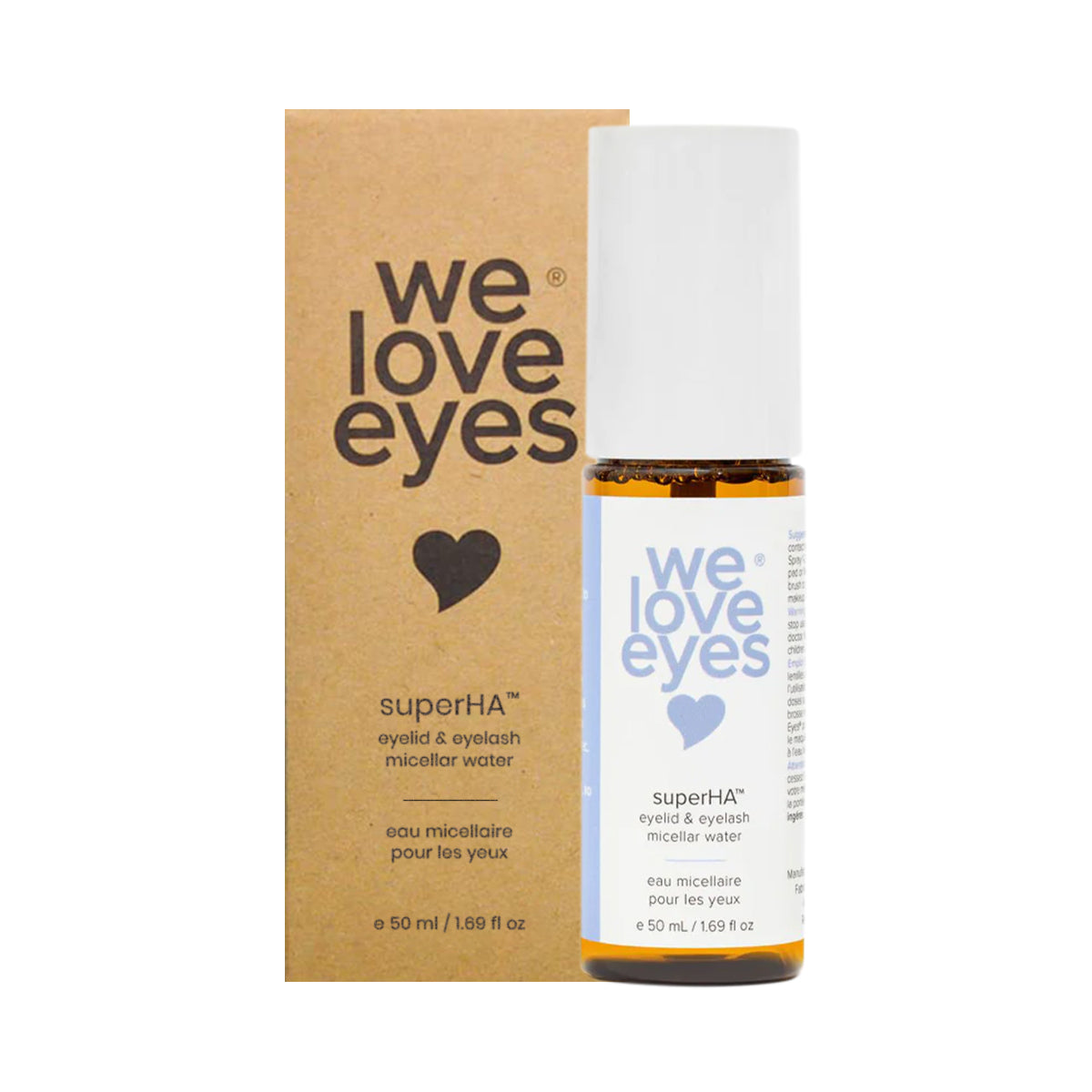 A We Love Eyes superHA Eyelid & Eyelash Micellar Water Make-up Remover bottle, white with blue text, sits in front of its brown packaging with a heart icon. Infused with tea tree water, this 50mL product enhances eye makeup removal and supports eyelid health.