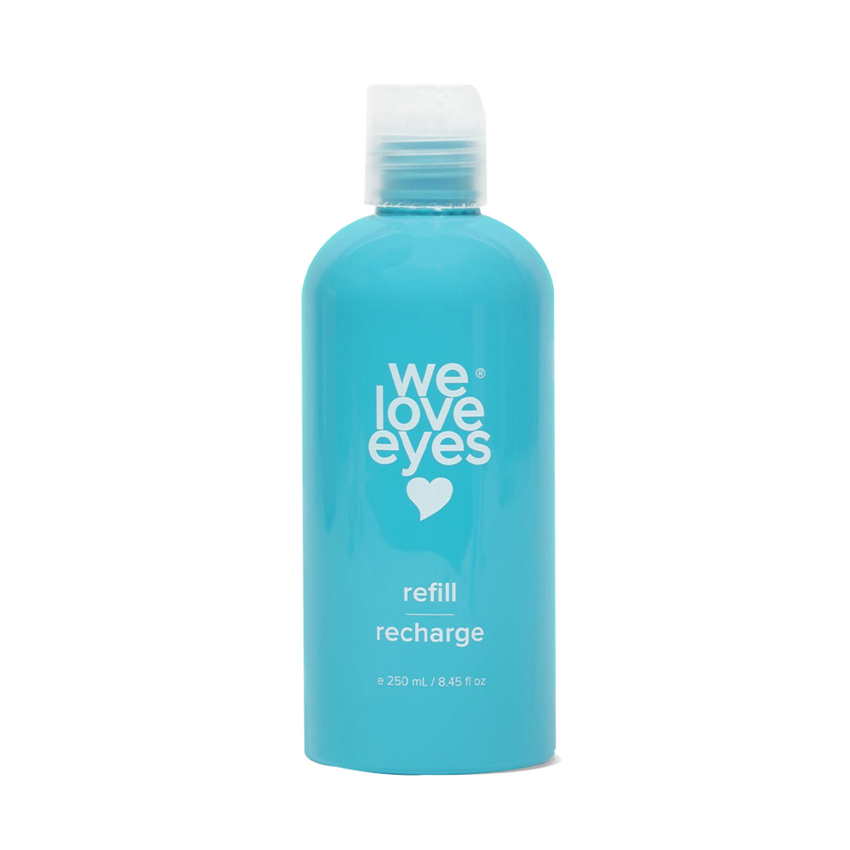 The We Love Eyes Tea Tree Eyelid Foaming Cleanser Refill features a turquoise bottle with a heart logo and we love eyes text, refill recharge, and volume of 250 mL / 8.45 fl oz. Its crafted from post-consumer recycled plastic and comes with a screw-on cap.