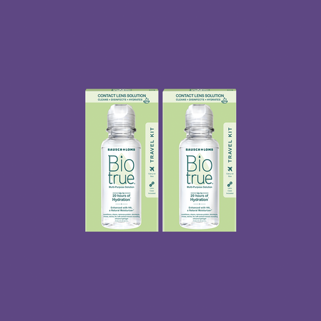 Two BioTrue Multipurpose Contact Lens Solution Travel Kits (2x 2oz/60mL) from Bausch + Lomb rest on a purple background, each featuring a BioTrue bottle that highlights the solutions hydration and clarity benefits for lenses.