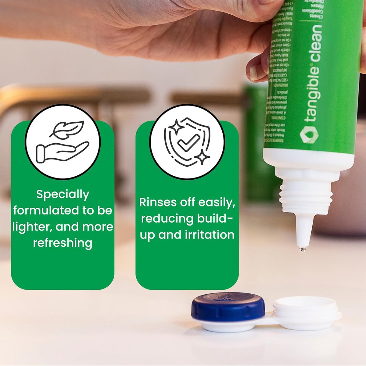 A hand holds a Tangible Clean 12 oz bottle over its case, boasting benefits: Specially formulated to be lighter and more refreshing and Multi-Purpose Formula rinses off easily, reducing build-up and irritation. Approved for all contact lenses, including Hydra-Peg coatings.