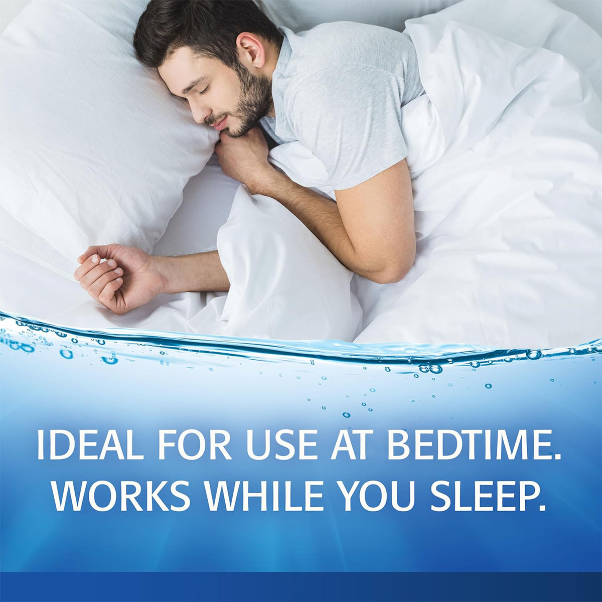 A man sleeps peacefully, hugging a white pillow. The blue gradient below reads: IDEAL FOR USE AT BEDTIME. WORKS WHILE YOU SLEEP, highlighting nighttime dry eye relief and long-lasting moisture with Refresh PM Lubricant Nighttime Eye Ointment (3.5g) by Abbvie for restful nights.