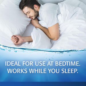 A man sleeps peacefully, hugging a white pillow. The blue gradient below reads: IDEAL FOR USE AT BEDTIME. WORKS WHILE YOU SLEEP, highlighting nighttime dry eye relief and long-lasting moisture with Refresh PM Lubricant Nighttime Eye Ointment (3.5g) by Abbvie for restful nights.