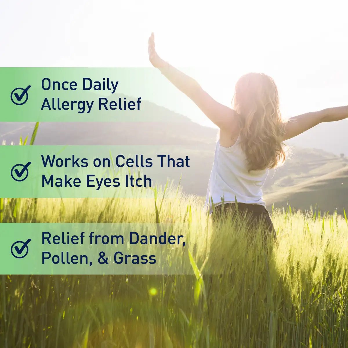 In a sunlit field, a person stands with arms outstretched, embraced by tall grass. The image text reads: Ocusoft Retaine Allergy Once Daily for Eye Itch Relief (2.5mL), Works on Cells That Make Eyes Itch, highlighting Allergy Eye Itch Relief with OCuSOFT Antihistamine Eye Drops.