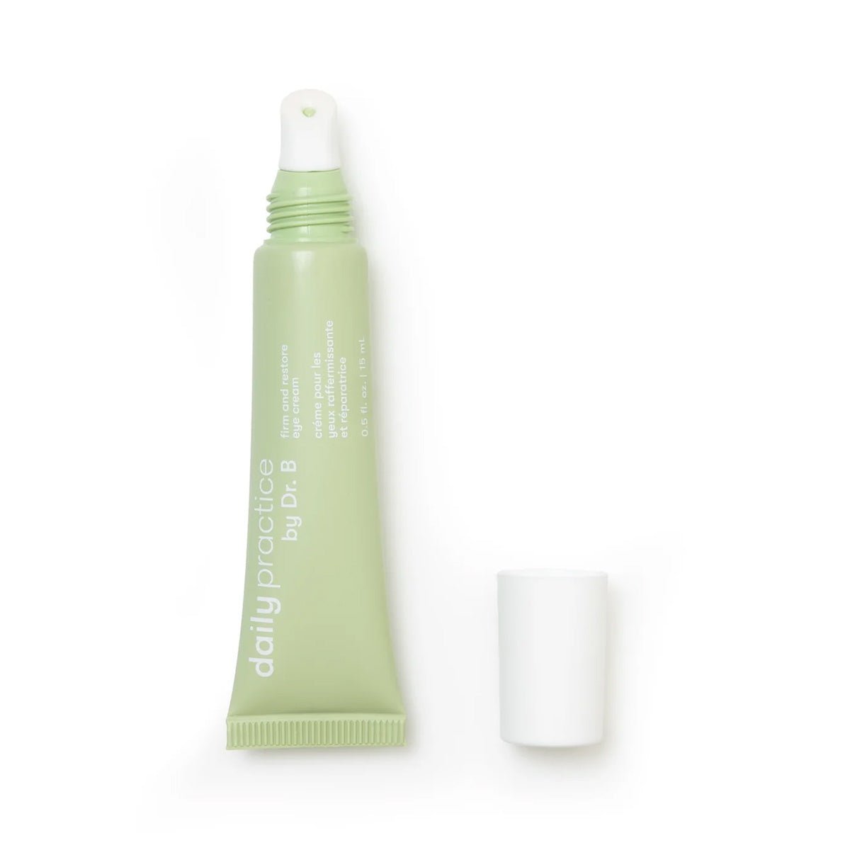 A tube of Daily Practice Firm & Restore Eye Cream by Daily Practice, shown in light green with the cap removed and a rounded applicator tip, claims to smooth, hydrate, and lift skin.