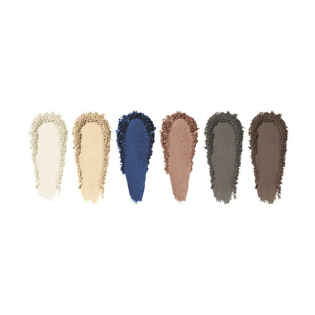 The Eyes are the Story Eyeshadow Palette by Eyes are the Story showcases six blendable high-pigment shades: light cream, beige, deep blue, shimmery bronze, dark grey, and medium brown.