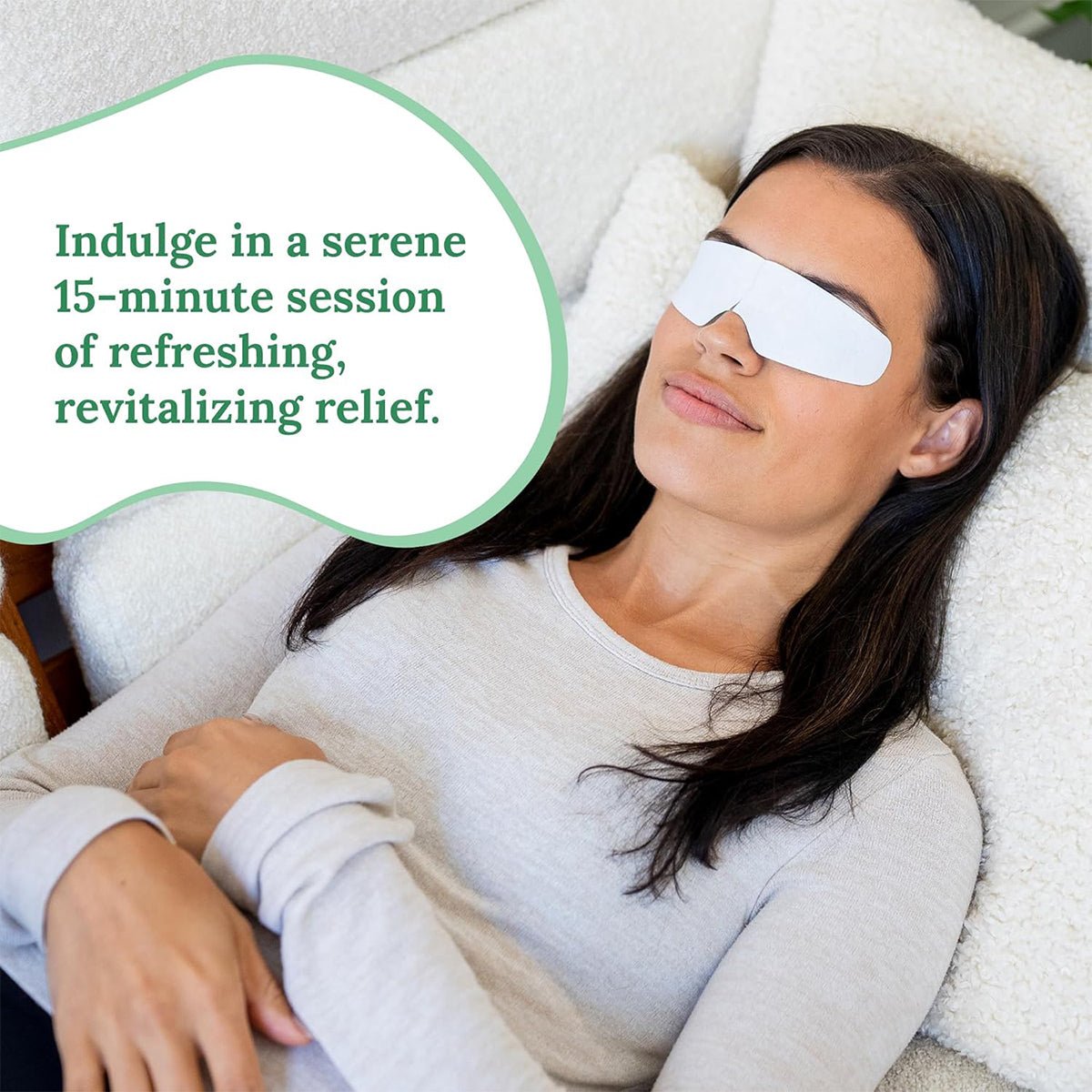 A woman with long dark hair relaxes on a cushioned surface, wearing white eye patches and a light gray top. A speech bubble reads, Enjoy a serene 15-minute session of refreshing relief with CorneaCare Rescue Cooling Eye Masks for Allergy Relief.