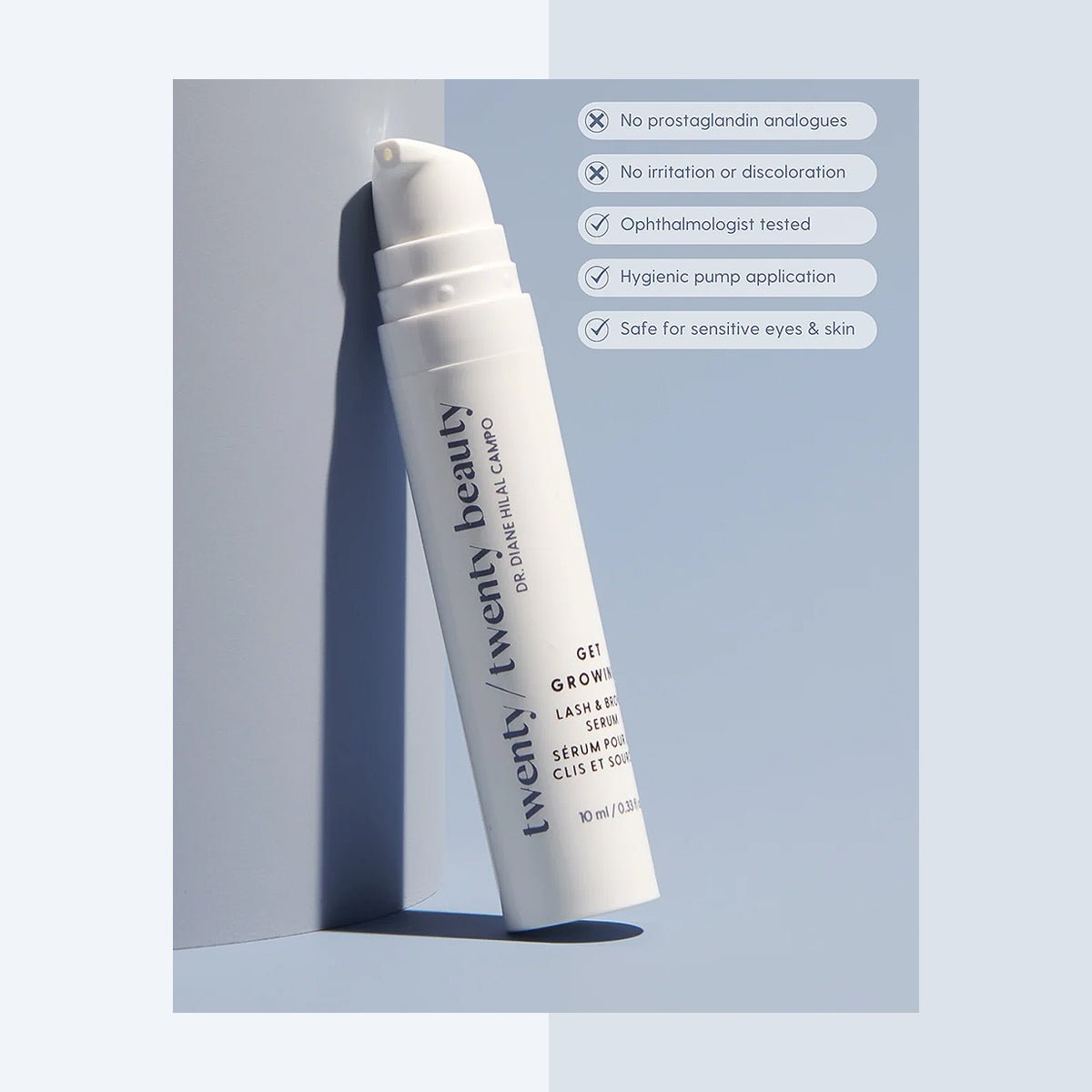 A white bottle of Twenty/Twentys Soothing Eye Duo, featuring Get Growing Lash Serum and Easy on the Eyes Facial Cleanser, is angled against a blue-grey backdrop. It highlights features: no prostaglandin analogues, no irritation, ophthalmologist-tested, hygienic pump—all safe for sensitive eyes and skin.