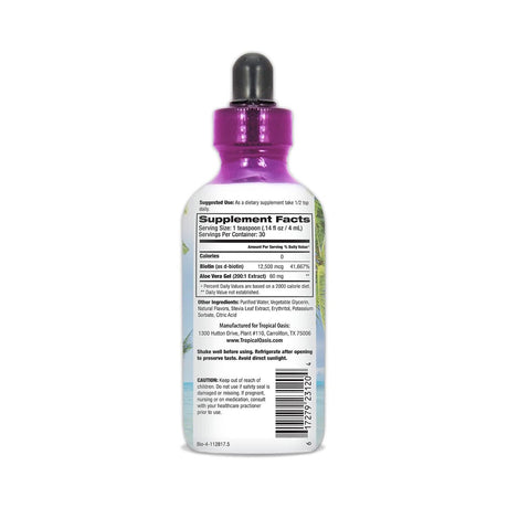 A 32oz. bottle features a purple dropper cap with a label detailing supplement facts, ingredients, and usage for Tropical Oasis Biotin Liquid Supplement for hair, nails, and skin. It includes Organic Aloe Vera Gel and is crafted by Tropical Oasis in Carrollton, TX.