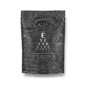 A black and white package with a face design, featuring Eyes are the Storys Refreshing Towelettes Wipes for Eyelid Hygiene (20ct), infused with soothing Calendula essence.
