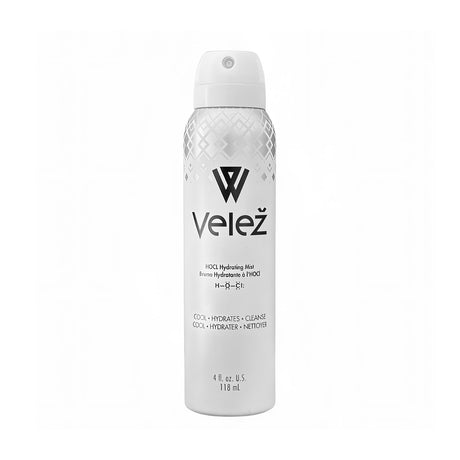 A white 4 fl. oz. spray of Velez Hypochlorous (HOCL) Hydrating Mist for Face and Eyelids features a top geometric pattern, Bag-on-Valve Technology, and a label with the logo, name, and benefits—cooling, hydrating, cleansing—in English and French.