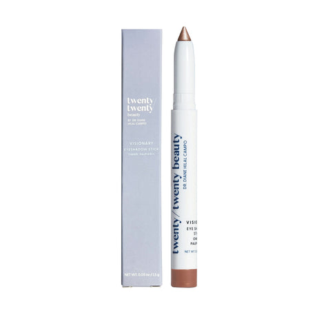 A white and silver pointed eye shadow stick is beside a matching light gray box labeled Twenty Twenty, revealing the ophthalmologist-tested Twenty Twenty Visionary Eye Shadow Stick by Dr. Diane Hilal-Campo, designed for style and comfort.