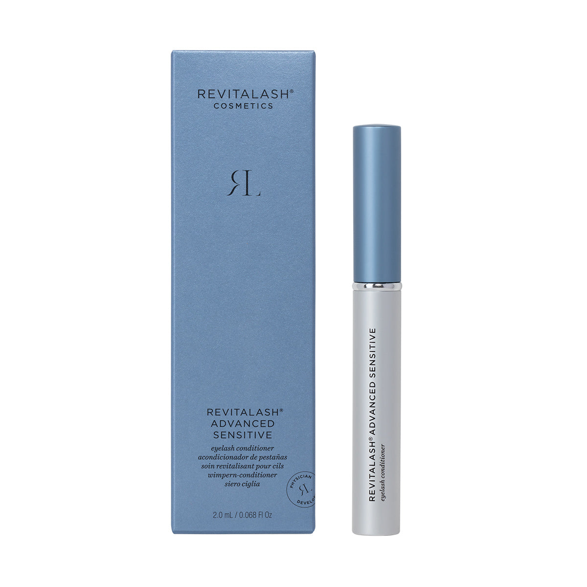 A blue box of RevitaLash Advanced Eyelash Conditioner and Enhancing Serum Sensitive (2.0mL 3 Mo. Supply) sits beside a white tube with a blue cap, featuring RevitaLash branding, tailored for those with delicate eyes seeking enhanced lash health.