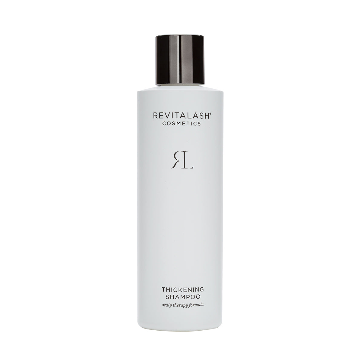 A white bottle of RevitaLash Thickening Shampoo with a black cap features a simple label. The brand and product description in black text on a white background promise enhanced hair health and effective scalp therapy.