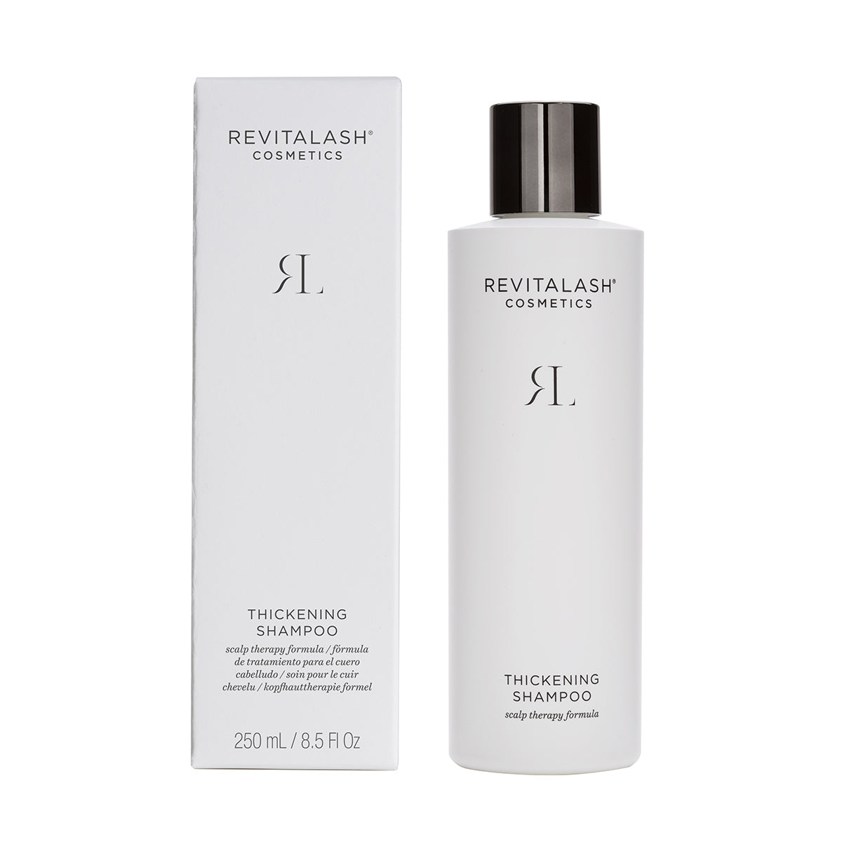 A white bottle of RevitaLash Thickening Shampoo, branded with sleek black text and a matching box, emphasizes hair health and scalp therapy. It features a stylish black cap and holds 250 mL (8.5 fl oz) of nourishing care.