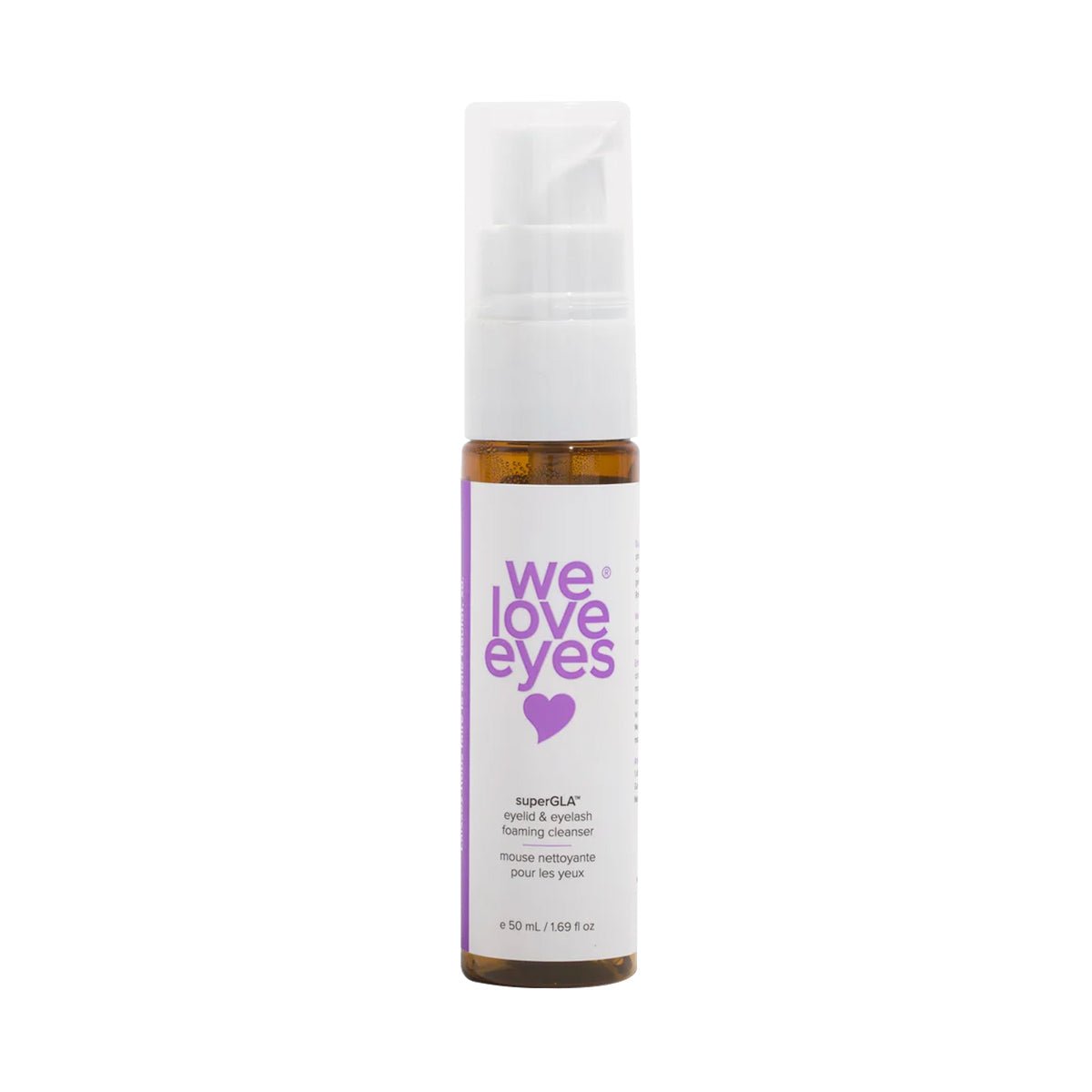 A cylindrical 50mL bottle of We Love Eyes SuperGLA Foaming Cleanser, enriched with omega-6, features a spray pump and soothing non-toxic formula for dry eyes. Its label reads We Love Eyes with a purple heart.