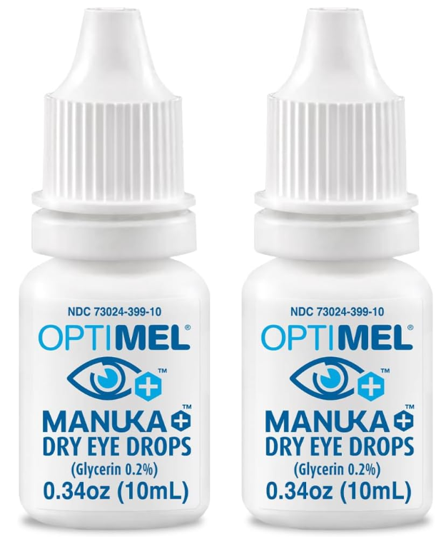 Two white bottles of Melcares Optimel Manuka Eye Drops, with blue text and caps, each containing 0.34 oz (10 mL), feature a blue eye graphic. The drops contain 0.2% glycerin and are designed to improve ocular surface health for those managing Meibomian Gland Dysfunction.